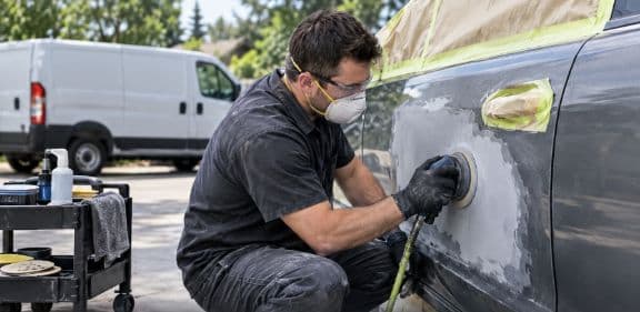 Illustration of dent repair on a vehicle door